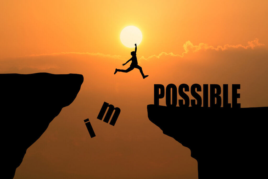Person embracing abundance with sunrise and financial symbols in background